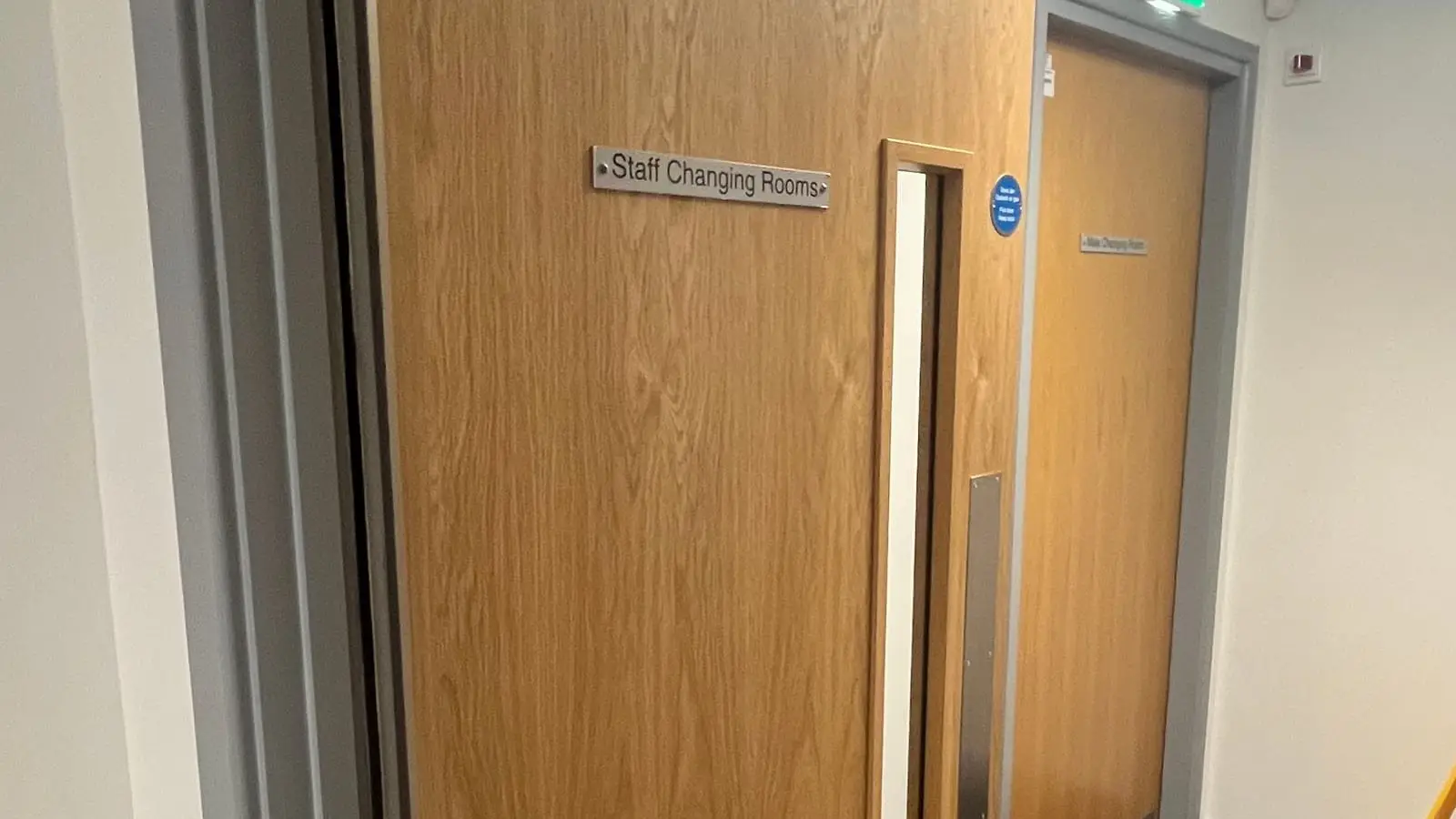 Oak fire doors along an interior corridor